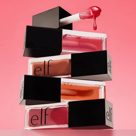 e.l.f. Glow Reviver Lip Oil stacked boxes in multiple shades on pink background